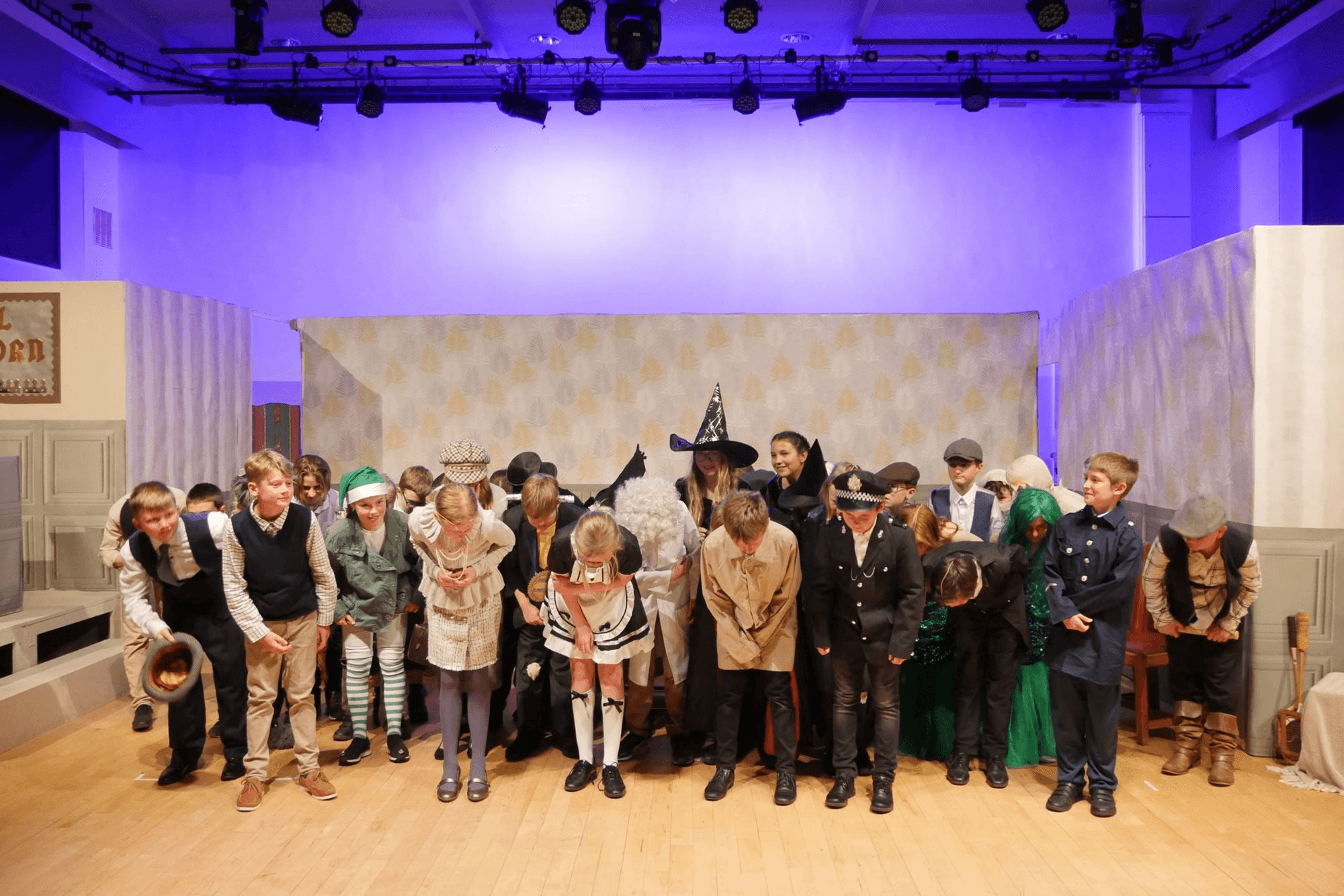 Year 6 children performing Murder at Hotel Crumhorn