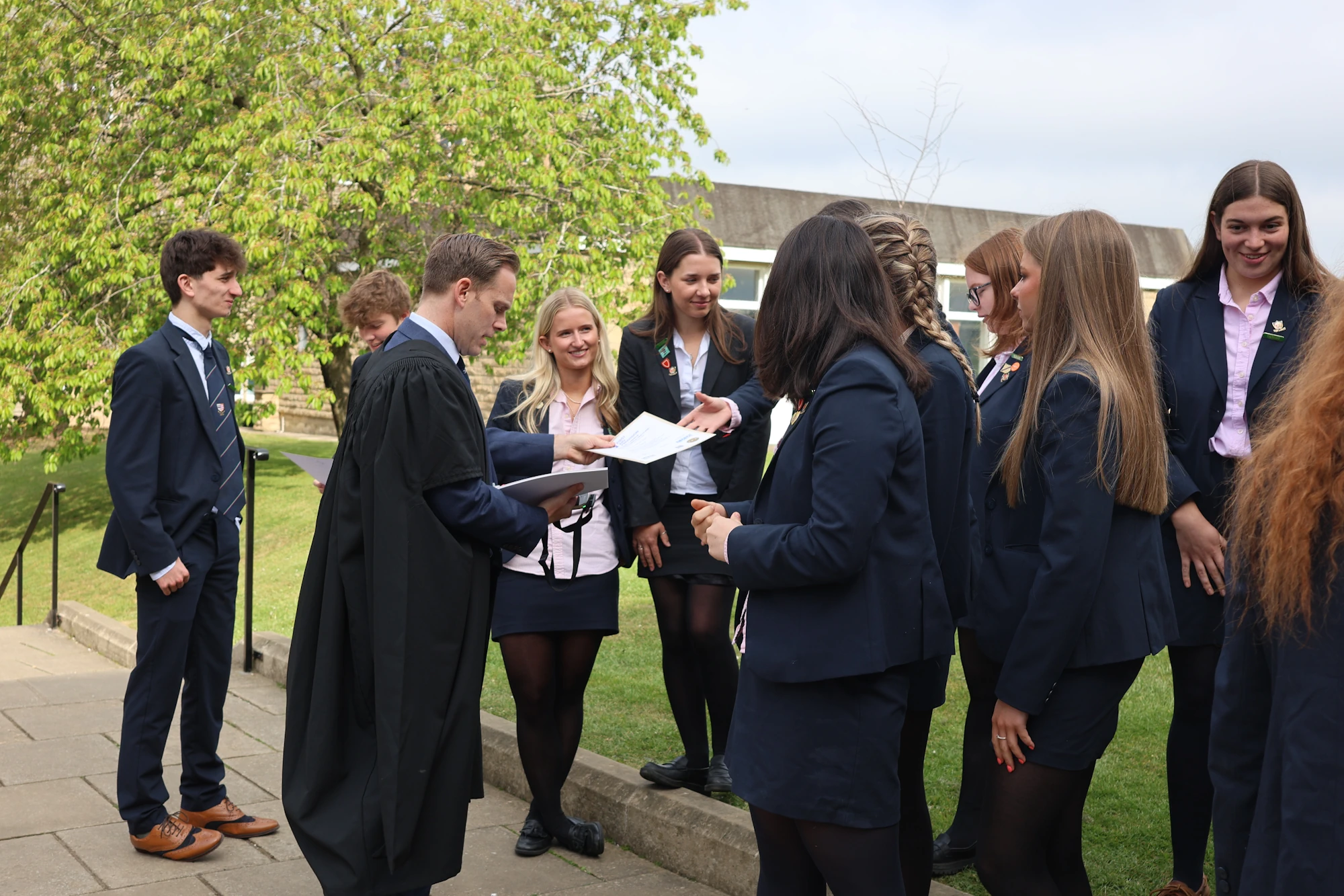 Barnard Castle School pupils getting handed A Level result certificates from Headmaster David Cresswell.