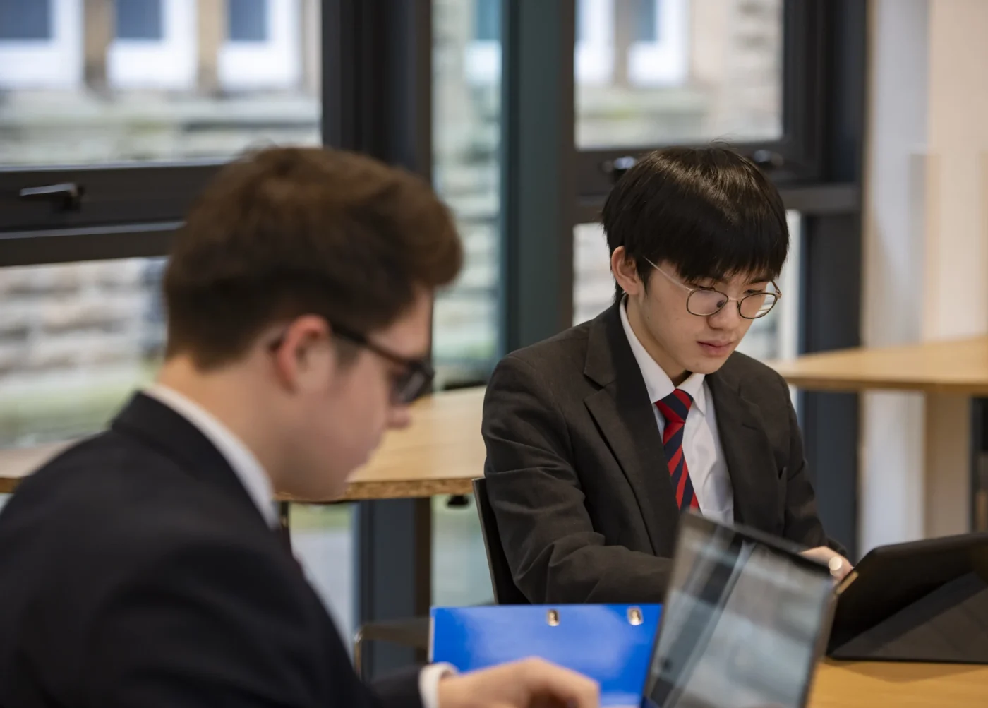 Barnard Castle School sixth form pupils sat at a table together.