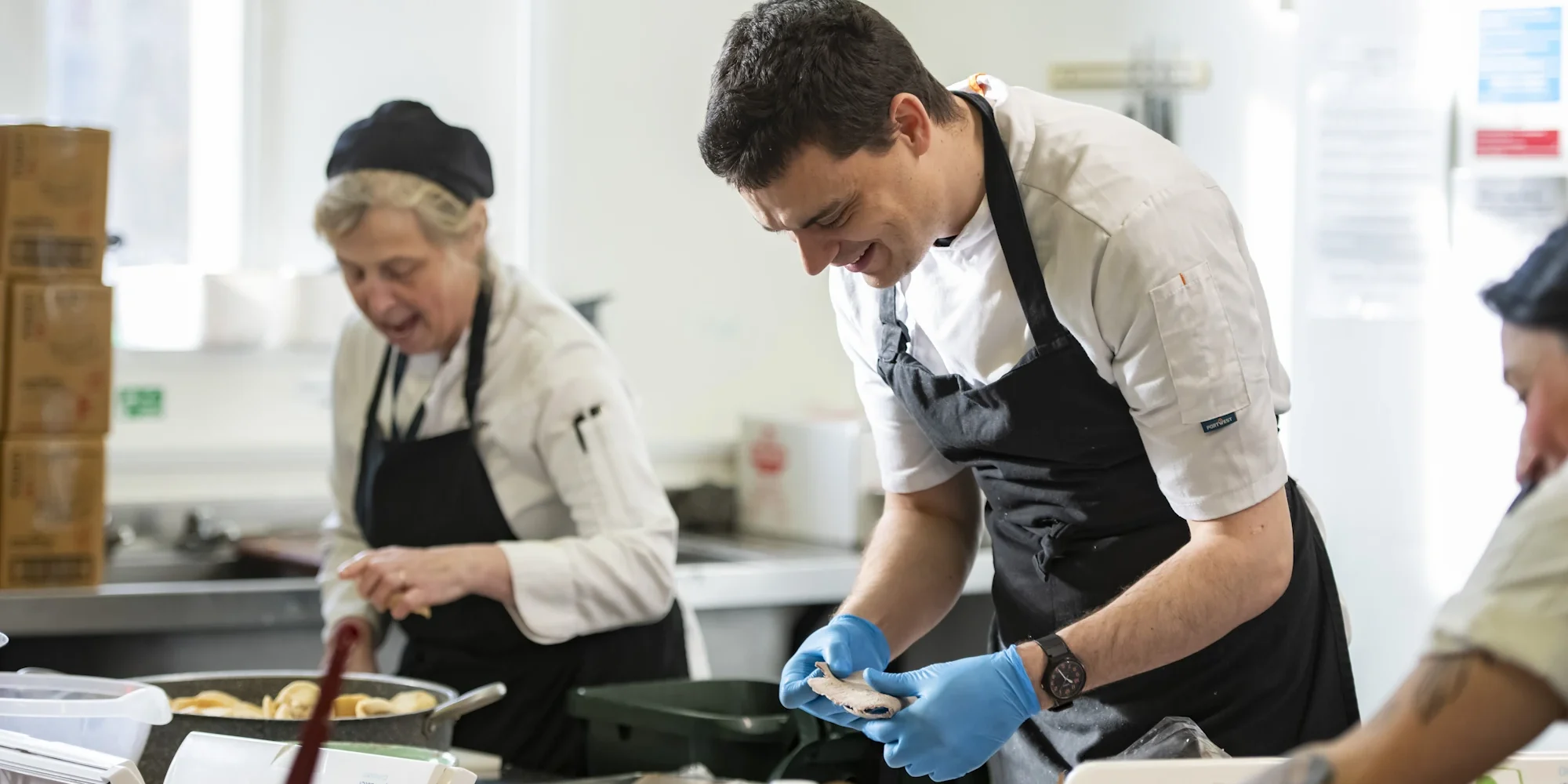 Barnard Castle School kitchen team cooking.
