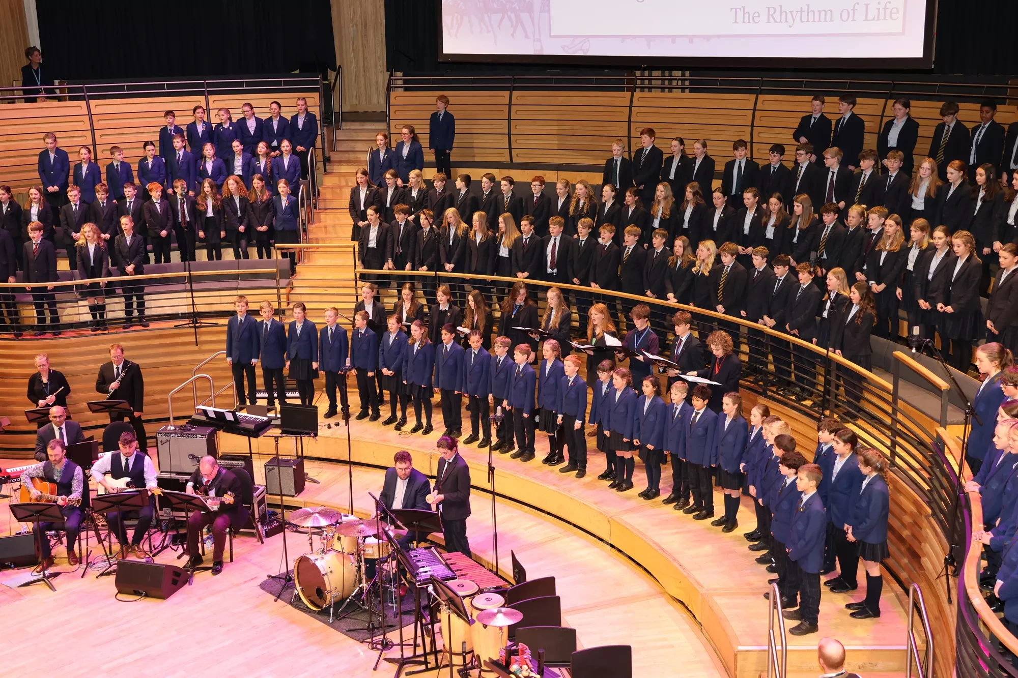 Barnard Castle School pupils singing in the glasshouse.