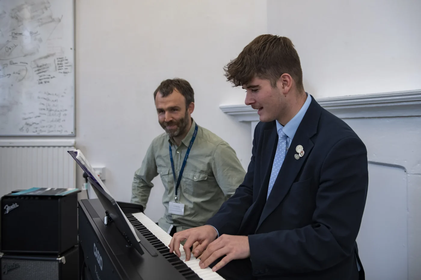 Barnard Castle School pupil having a piano lesson with a teacher.