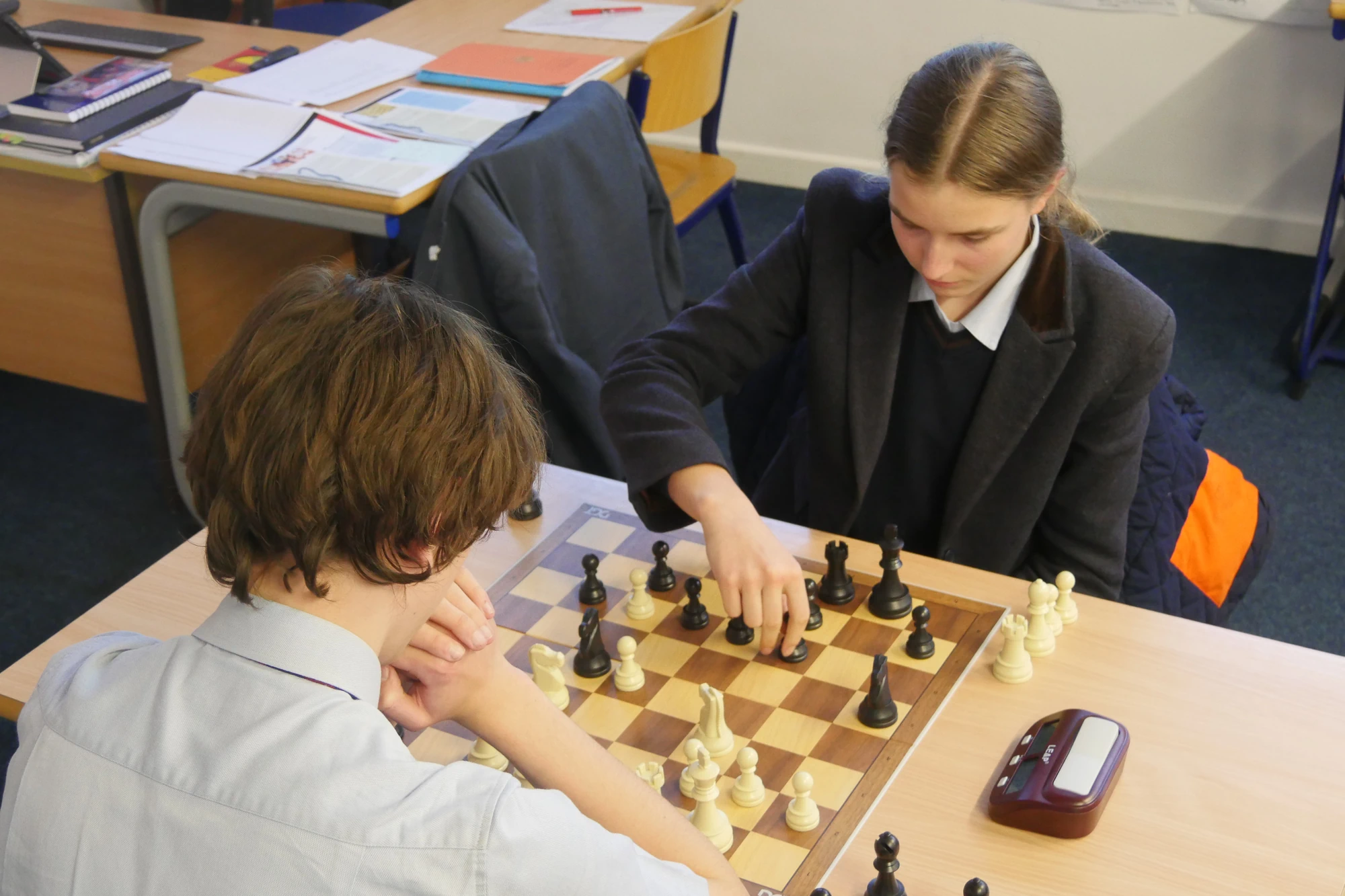 Barney students playing chess.