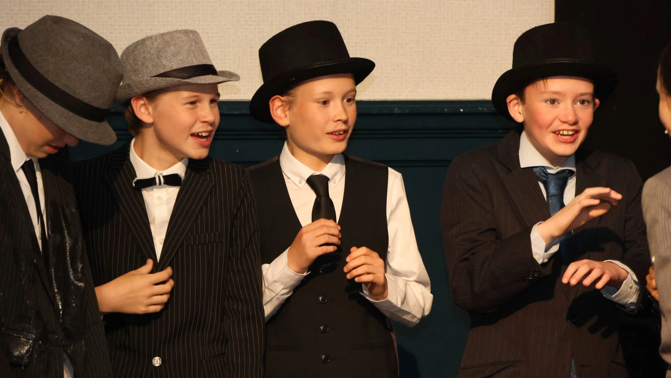 Students dressed as gangsters in Bugsy Malone.