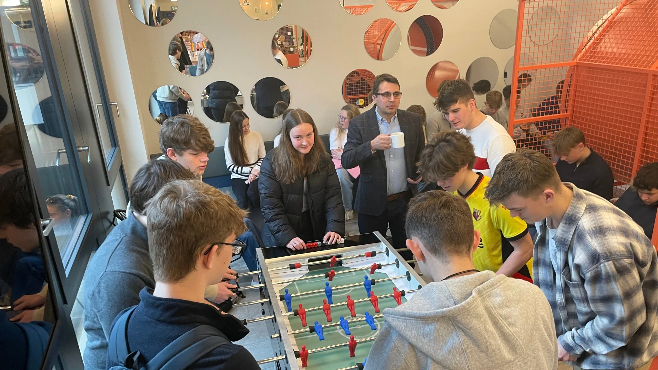 Barney students playing bar football.