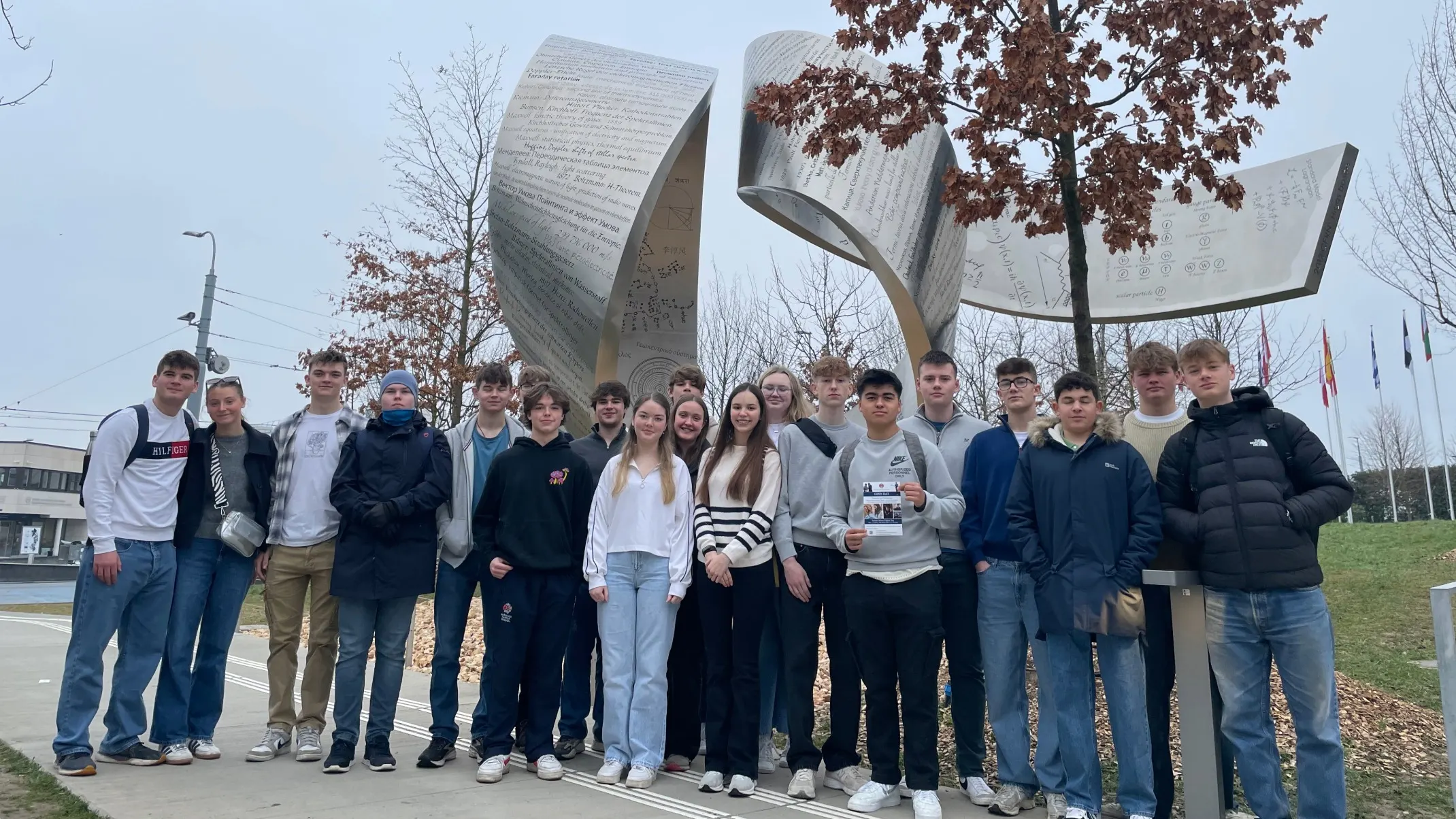 Barney students lined up in front of a large Geneva monument.