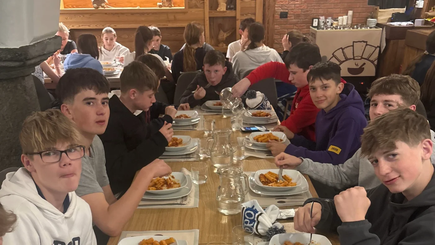A group of Barney students sitting eating in a food hall.