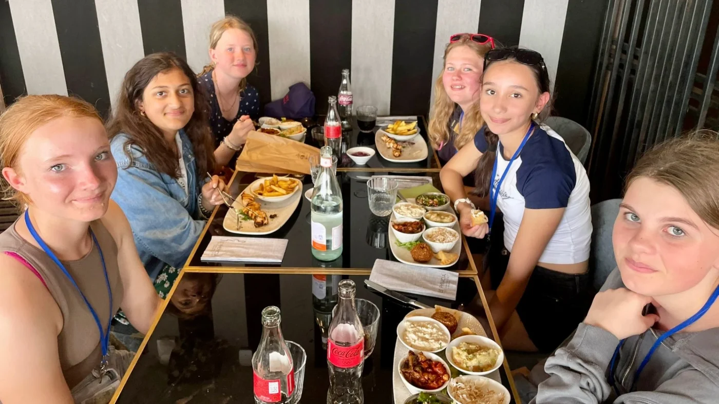 A group of Barney students enjoying dinner.