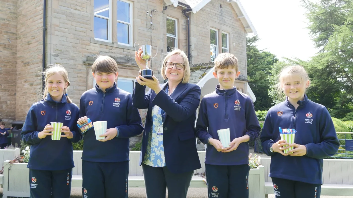 Barney Prep School students celebrate winning an award.