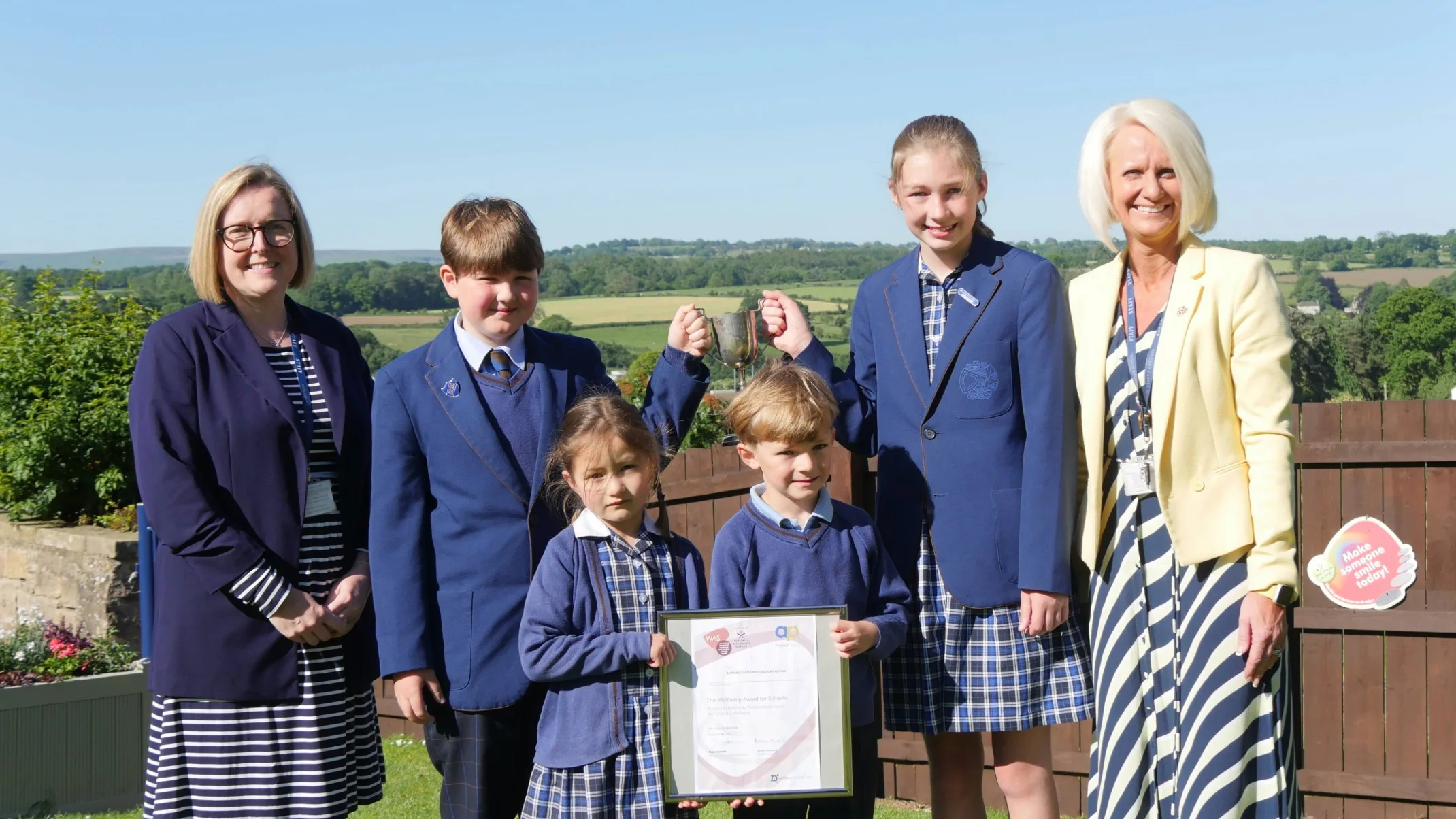Barney Prep School students celebrate winning an award.