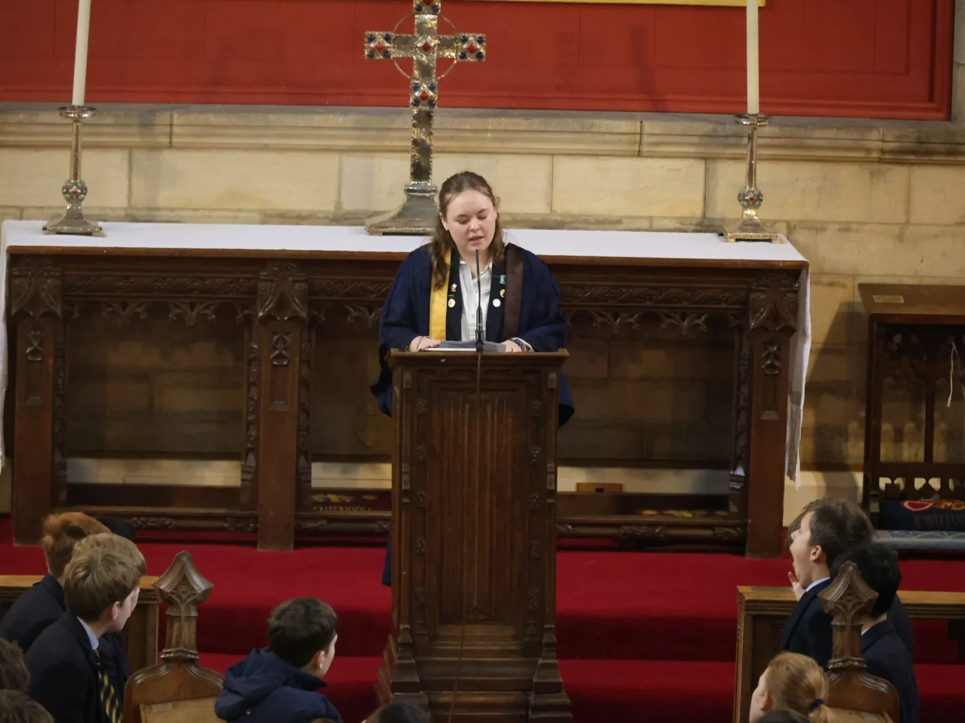 Sixth Form pupil speaking to assembly.