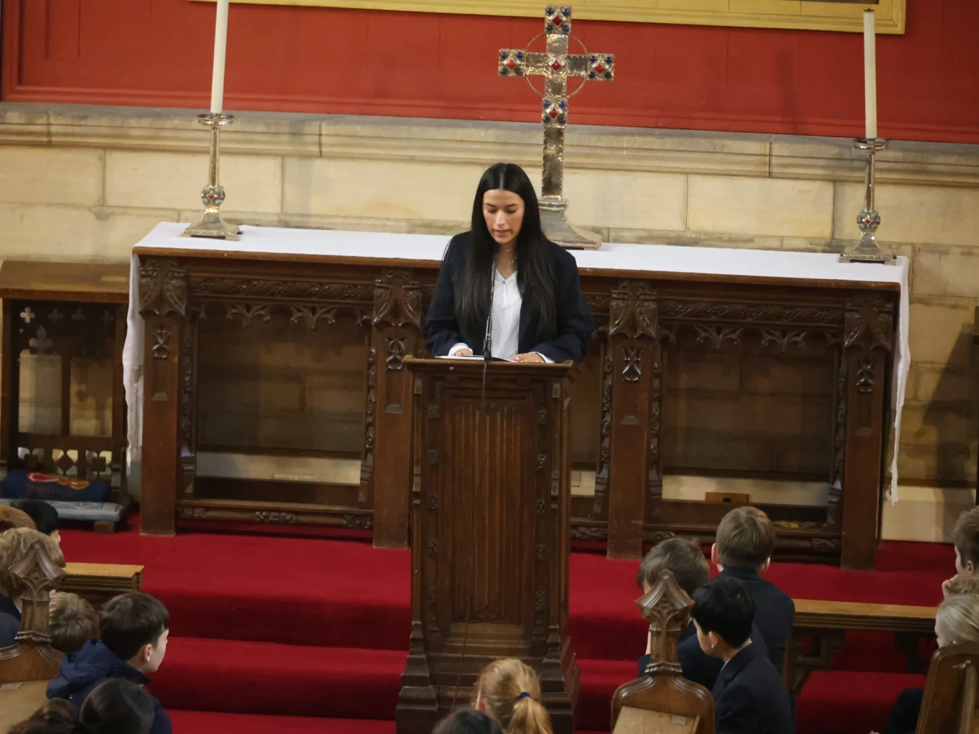 Sixth Form pupil speaking to assembly.