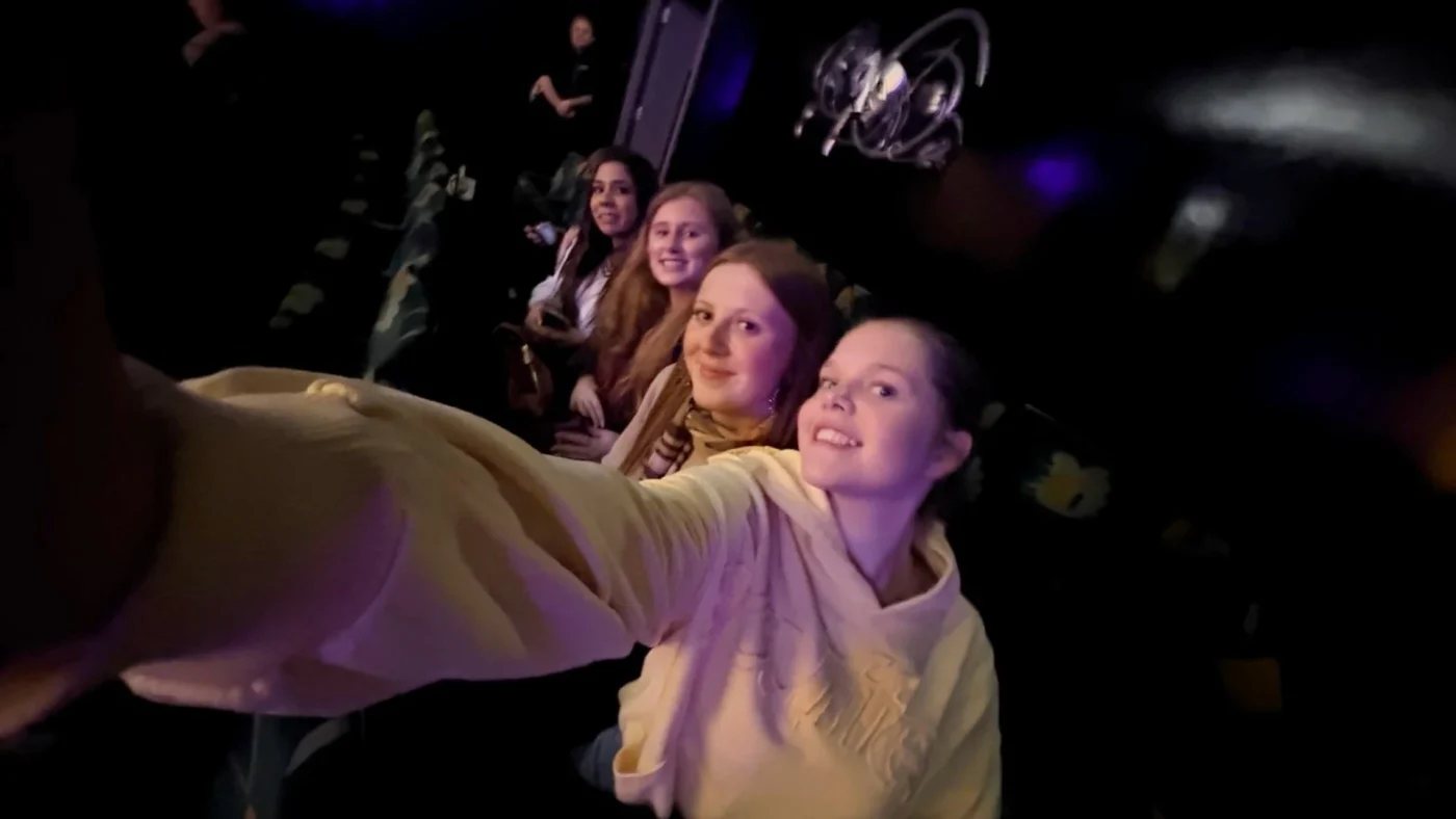 Barney Theatre students taking a selfie in a theatre.