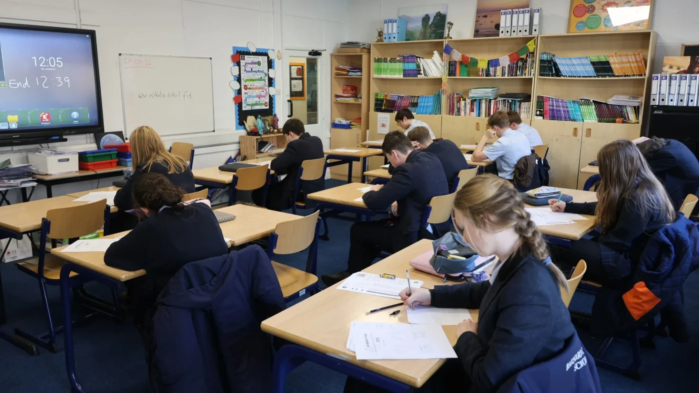 Students working during the UKMT Intermediate Maths Challenge.