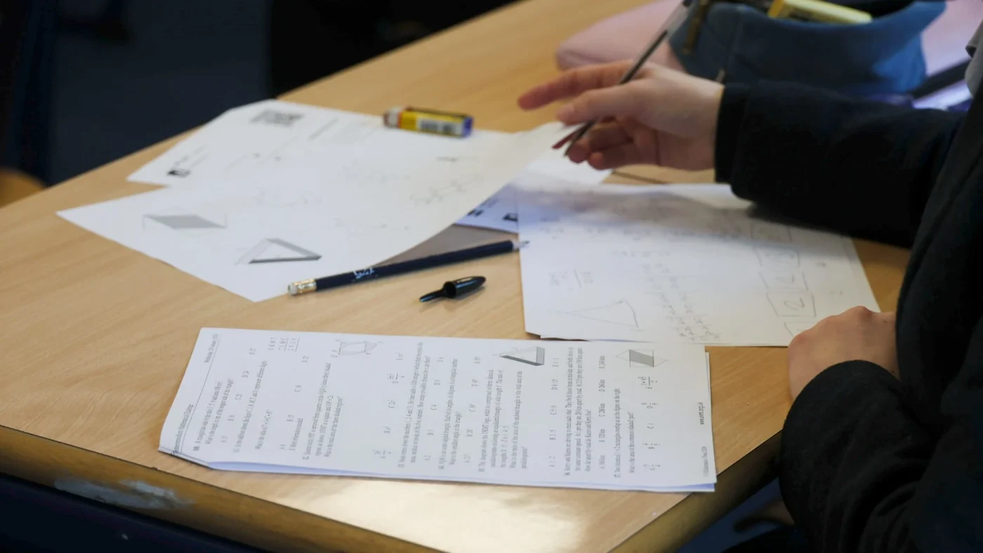 A close-up of a student's notes from the UKMT Intermediate Maths Challenge.