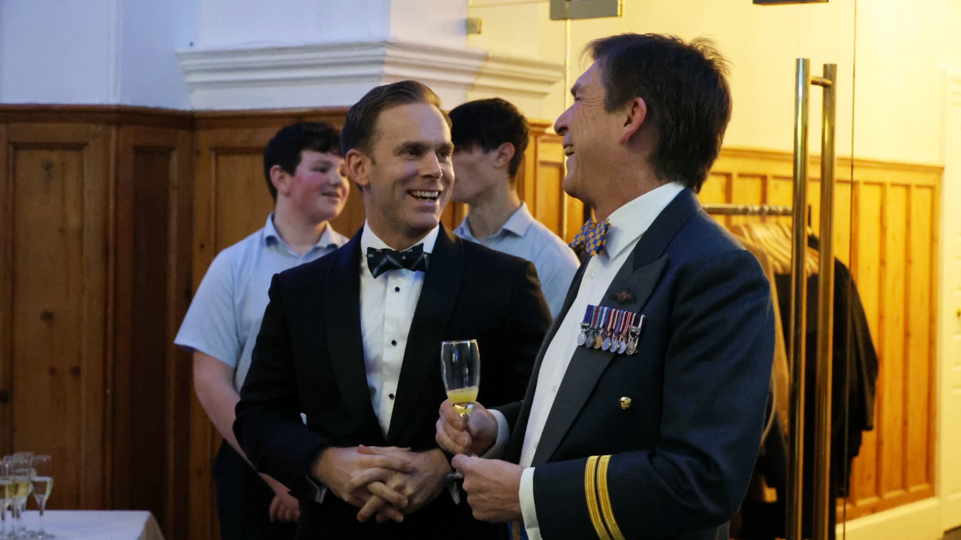 Headmaster David Cresswell speaking with guest at regimental dinner