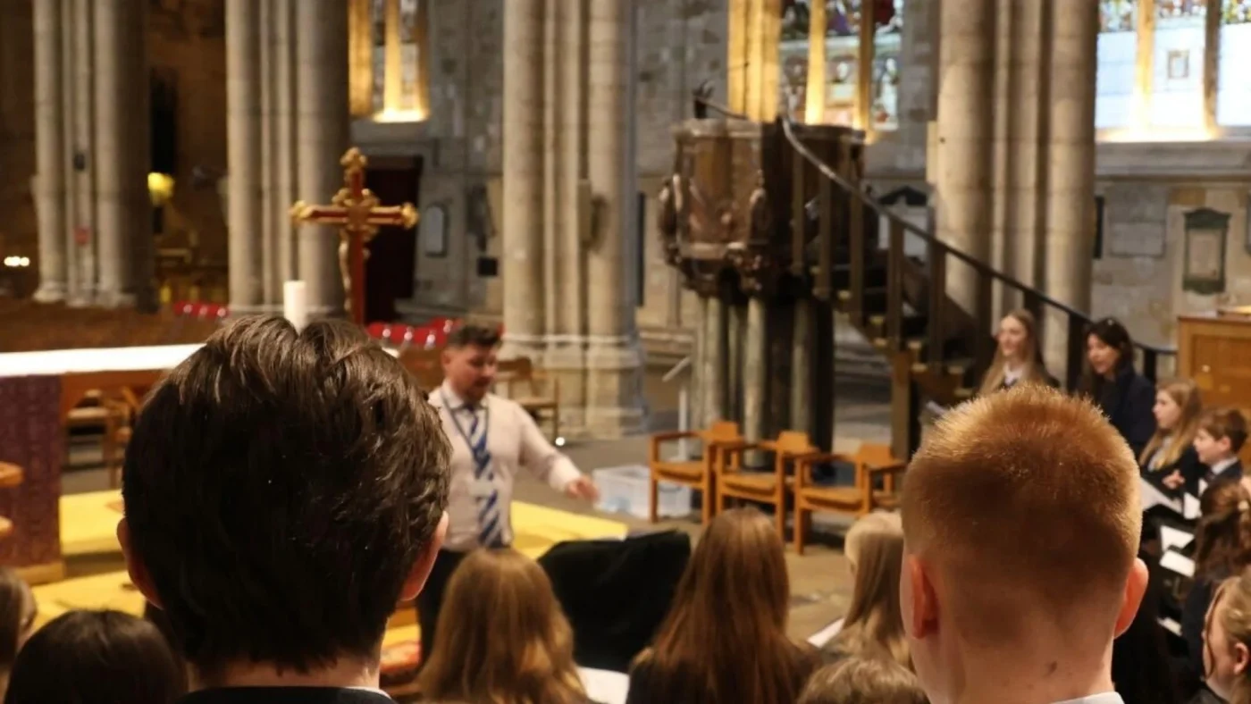 Barney's Director of Music, George Ford, conducting students at Ripon Cathedral.
