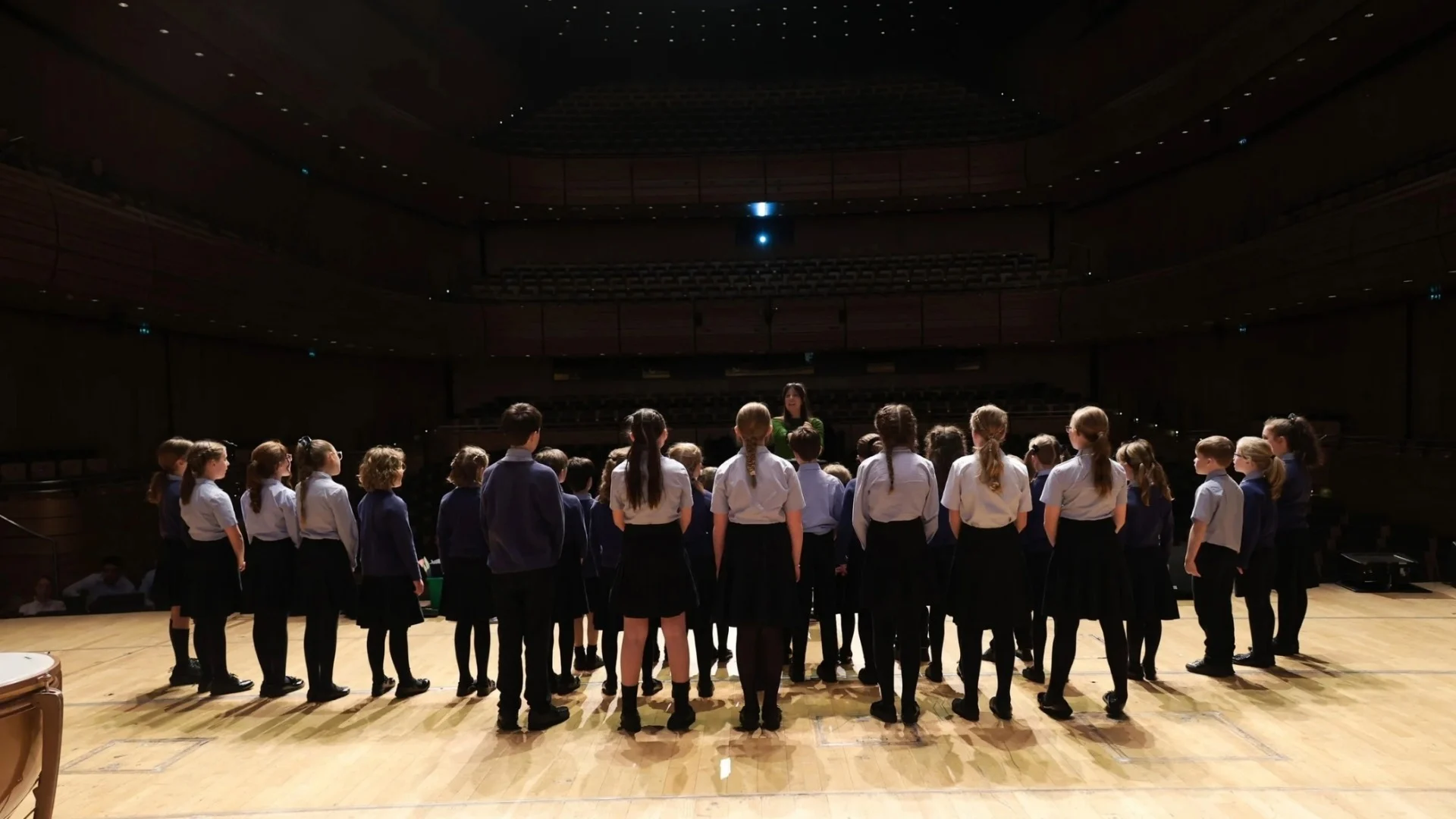 Barney students stood on stage at The Glasshouse in Gateshead.