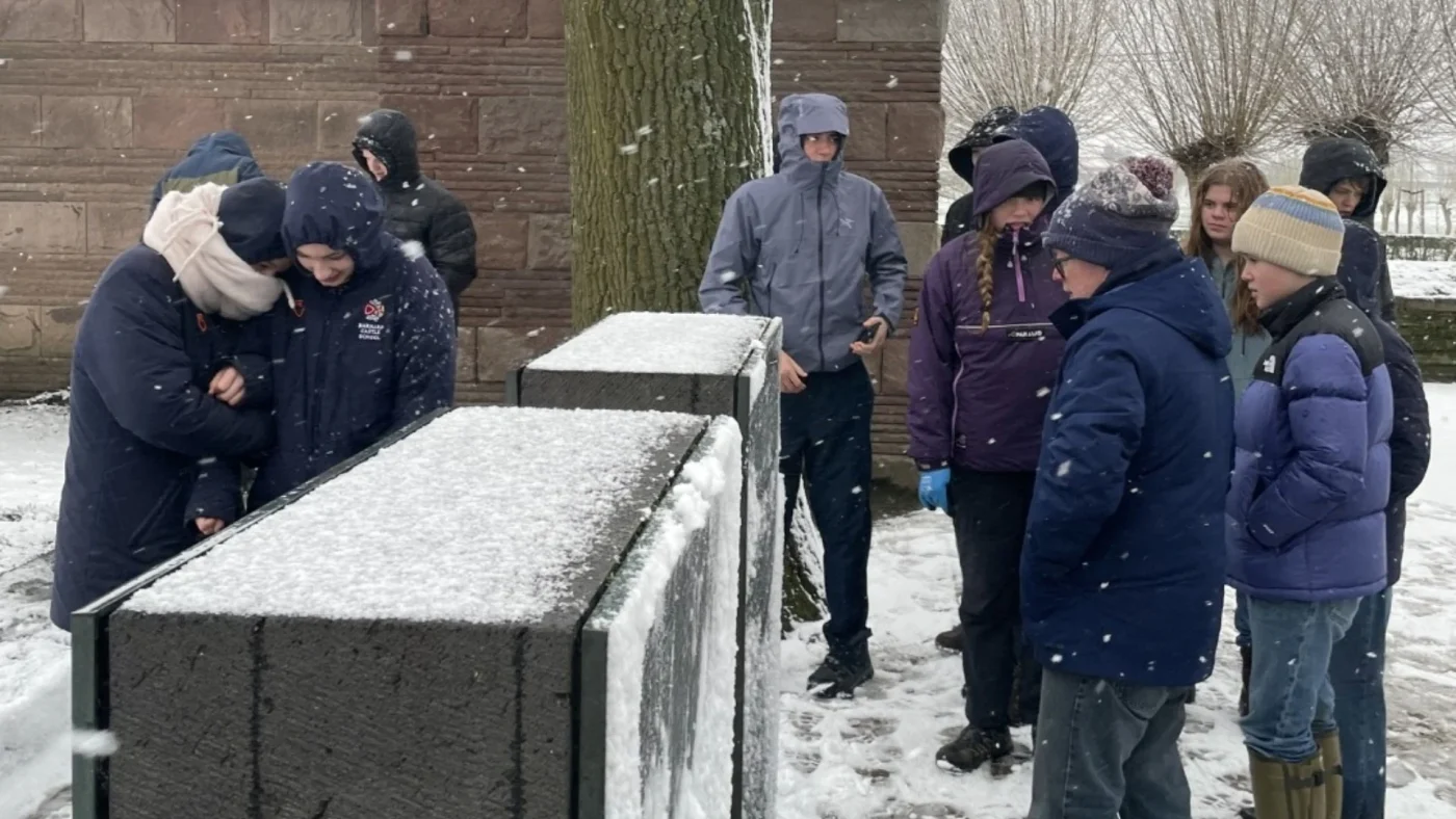 Barney students explore a snow-covered WW1 cemetery.