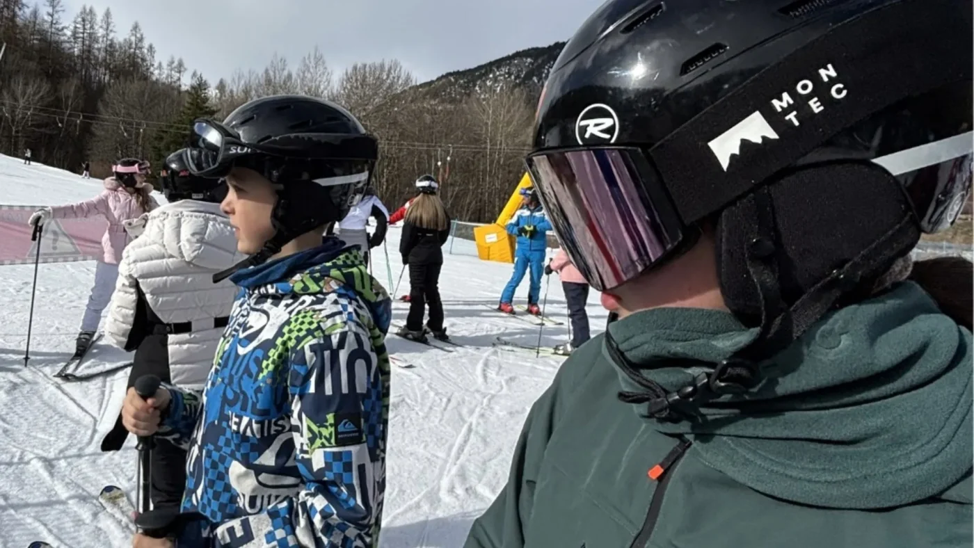 Two Barney students wearing their ski gear in the snow.