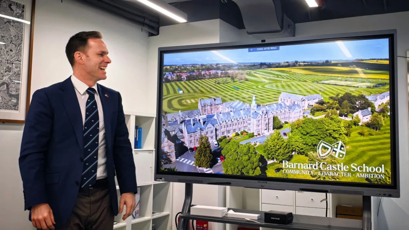 Barney Headmaster David Cresswell gives a presentation in China.