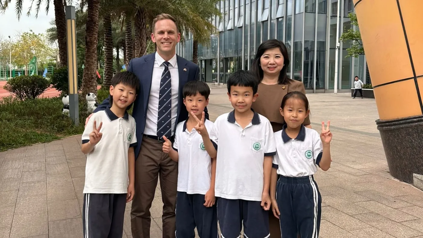 David Cresswell with young students on his trip to China.