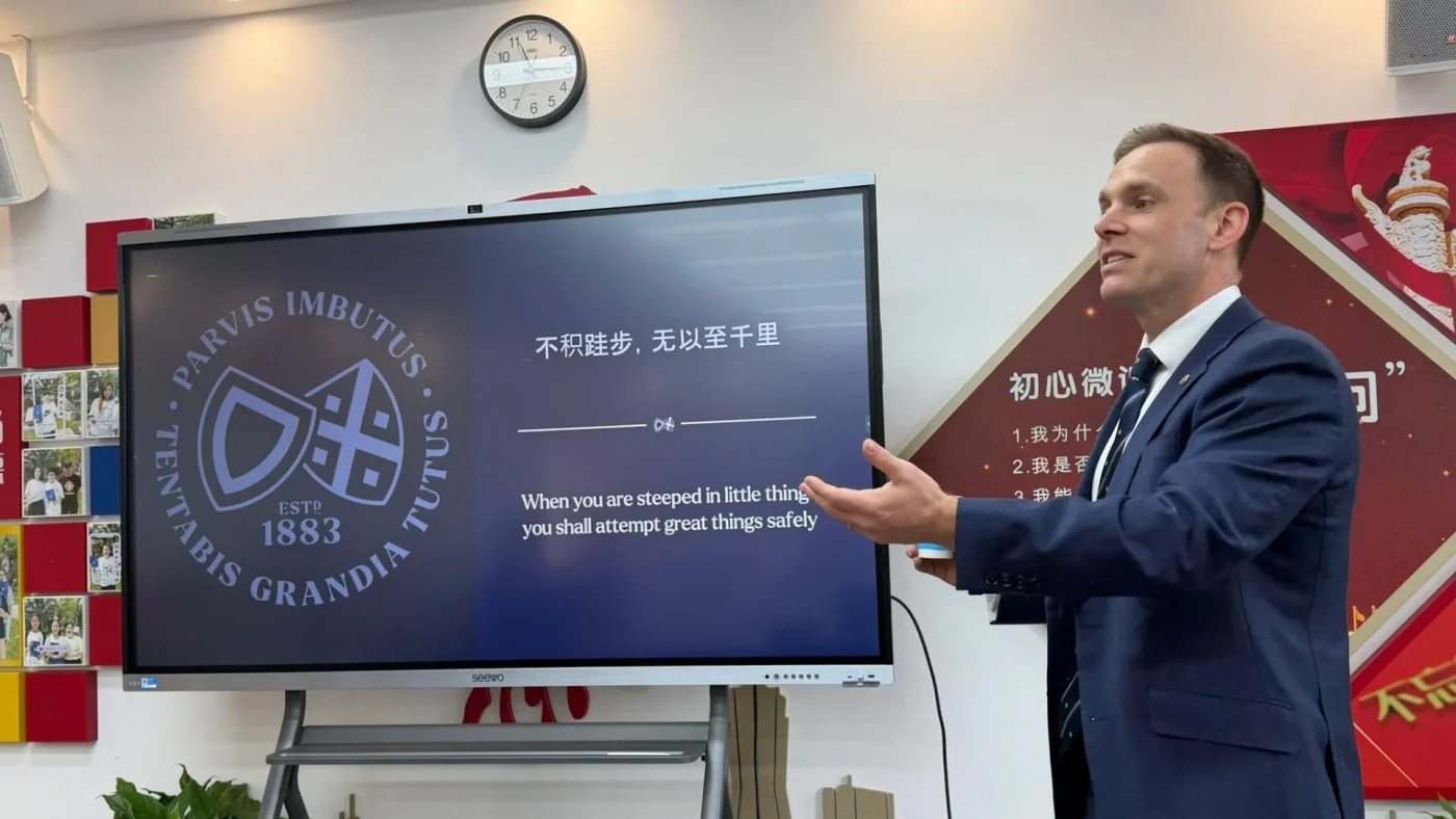 Barney Headmaster David Cresswell gives a presentation in China.
