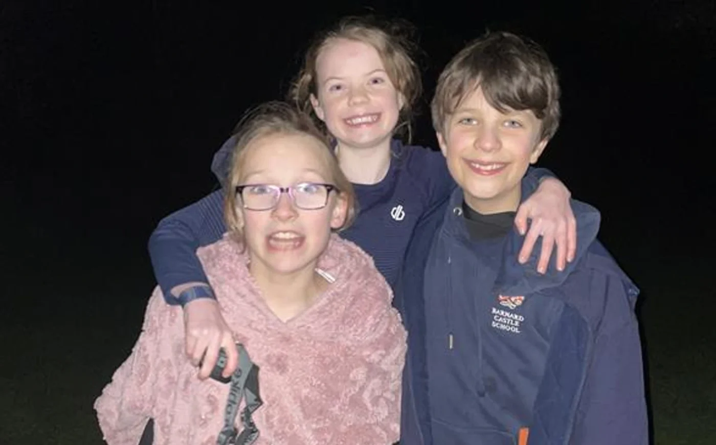 Three smiling Barney pupils during the Great Tommy Sleep Out.