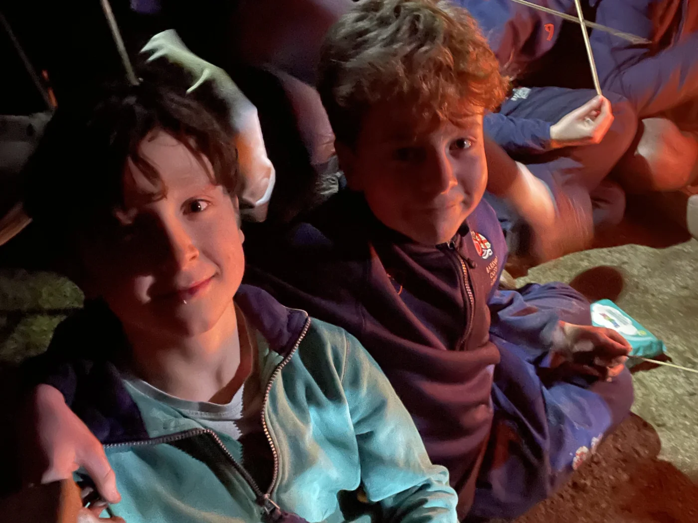 Two Barney pupils around the campfire during the Great Tommy Sleep Out.