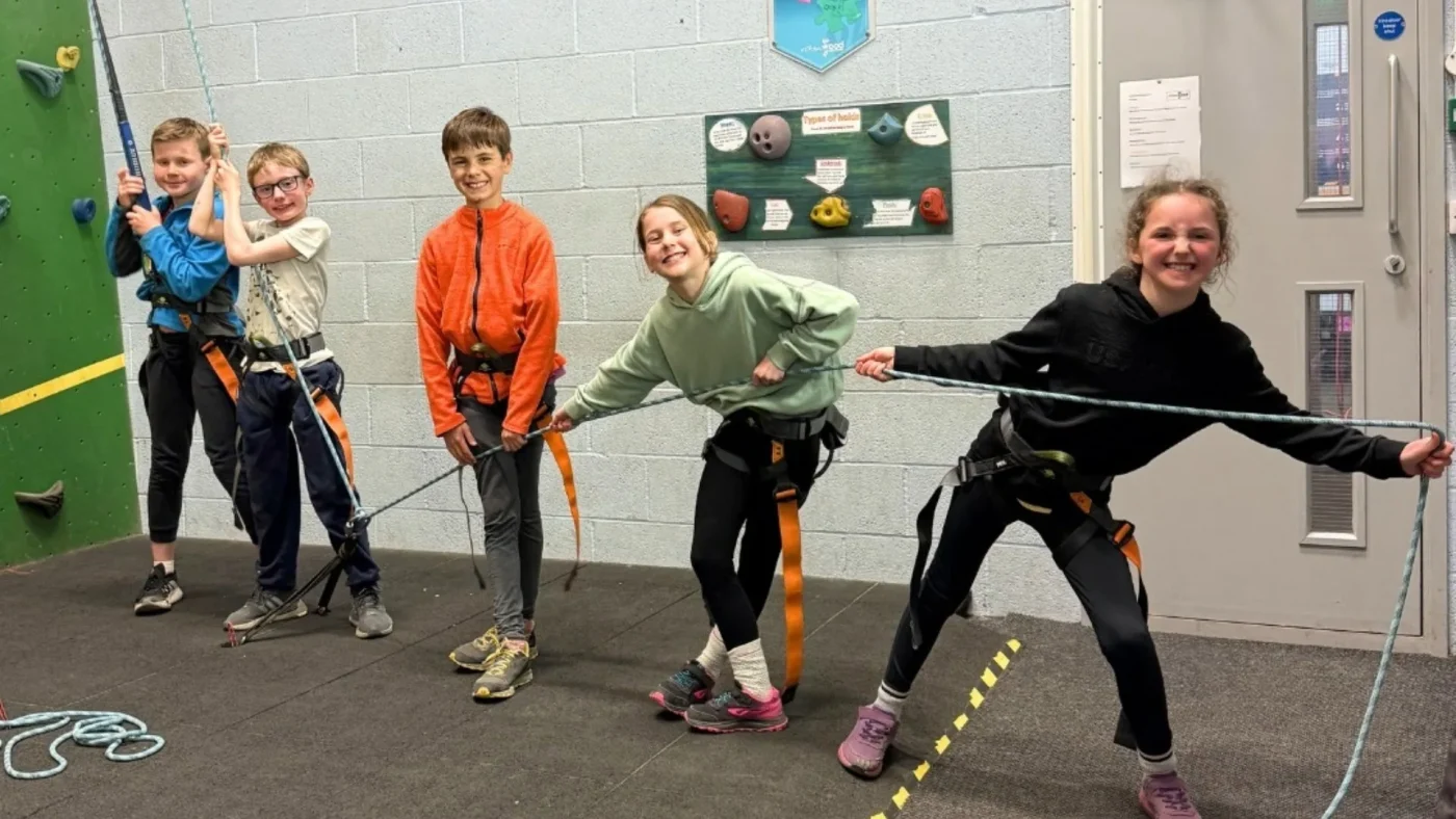 Year 4 Barney students lining up for a climbing wall.