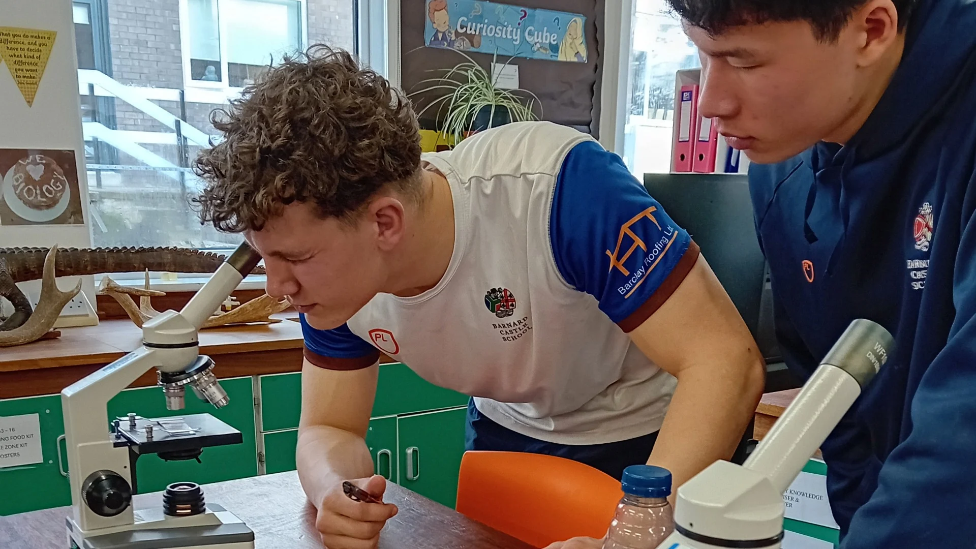 Two Barney students using microscopes during Science Week 2026.