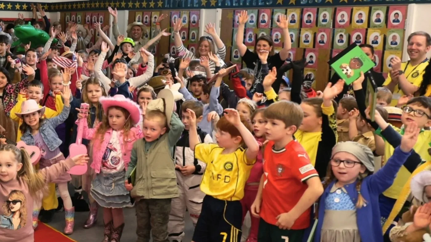 Barney Prep students dancing in fancy dress.