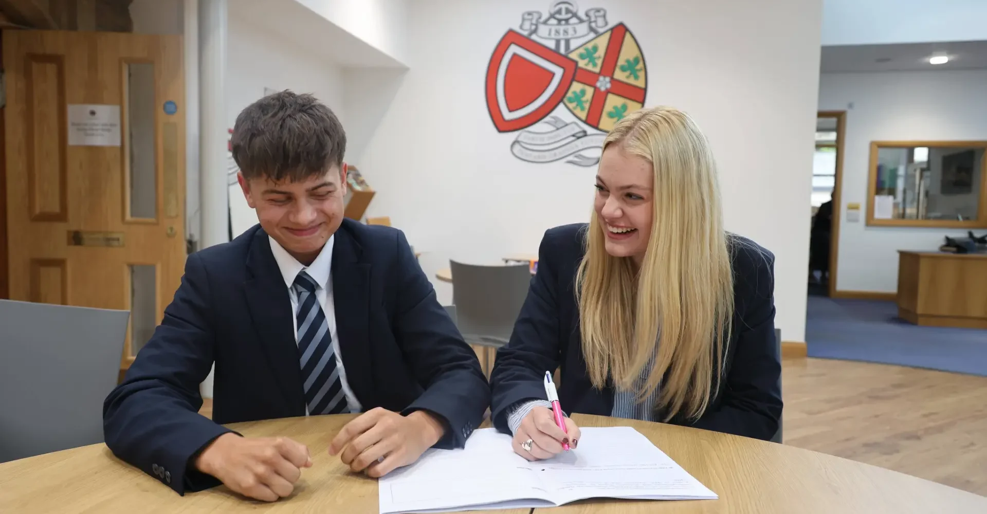 Two students studying together at BCS