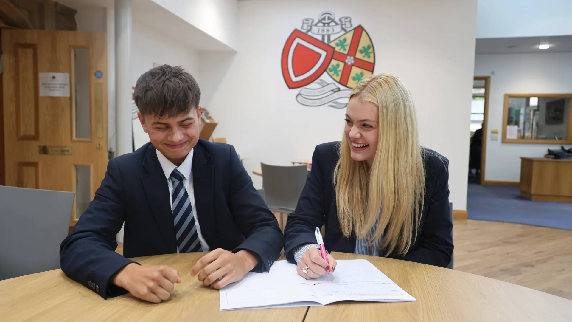 Two students studying together at BCS