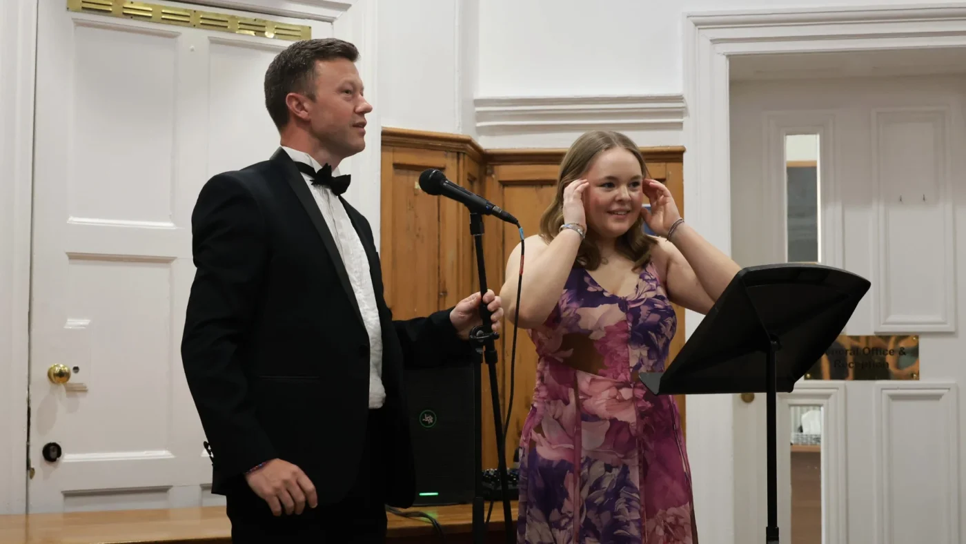 A Barney student and staff member speaking at the 2026 Longfield Dinner.