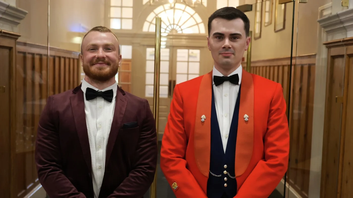 Two Barney staff members in formal attire for the 2026 Longfield Dinner.
