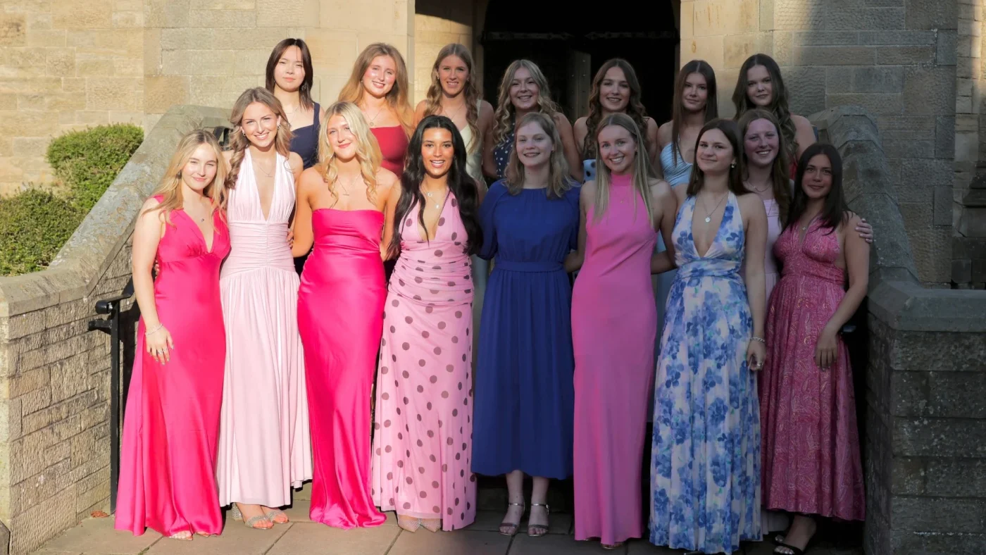 A group of Longfield Girls’ Boarding House members in formal attire.