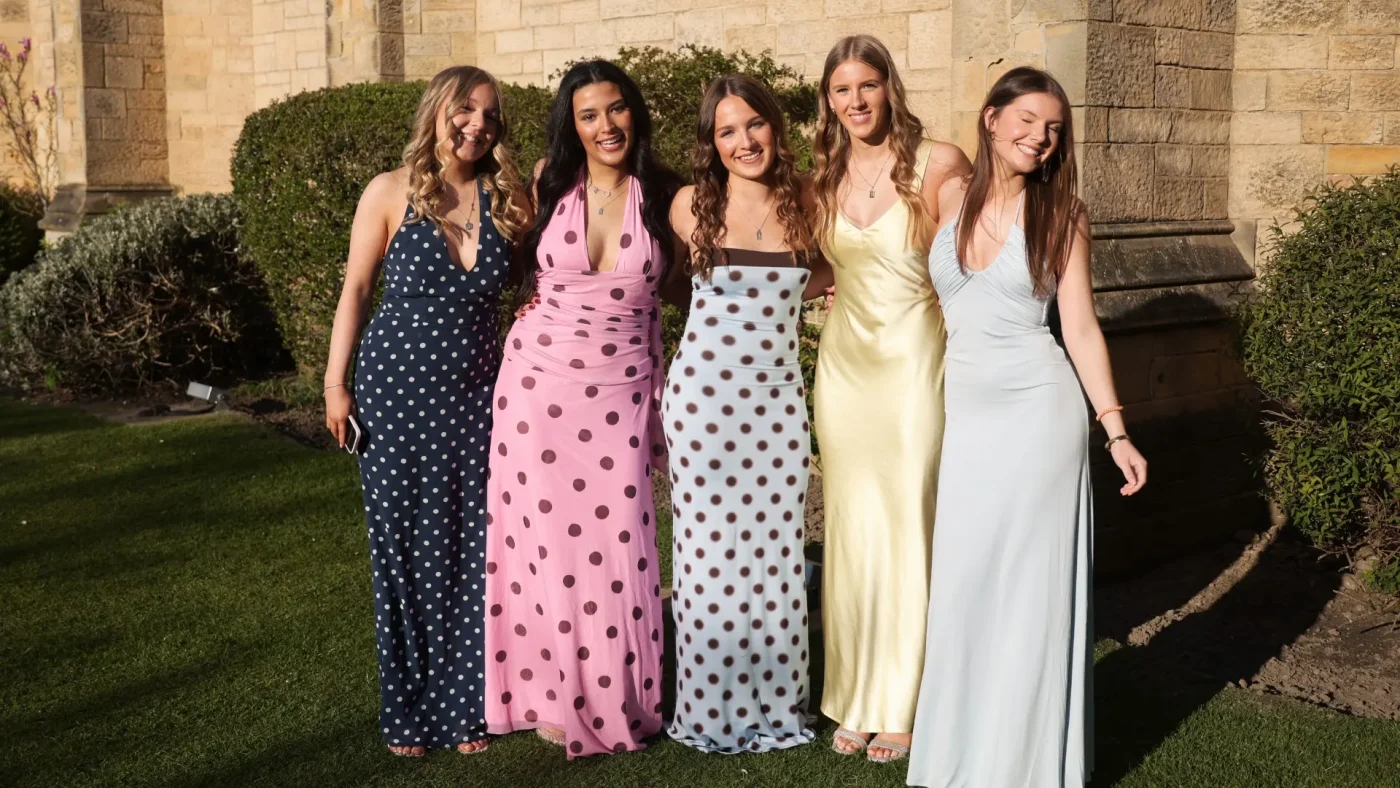 Longfield Girls’ Boarding House members in dresses.