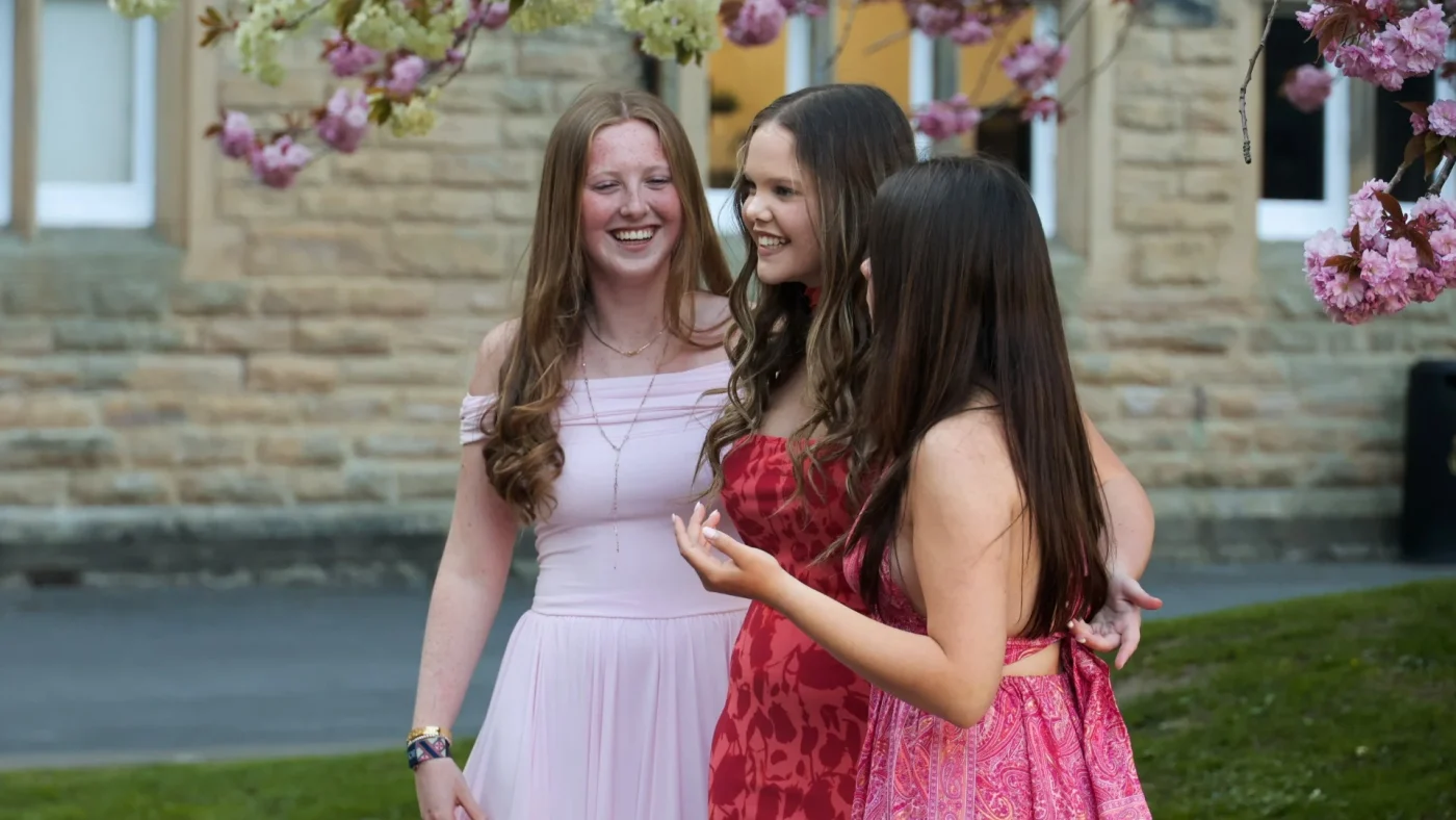 Longfield Girls’ Boarding House members laughing together.