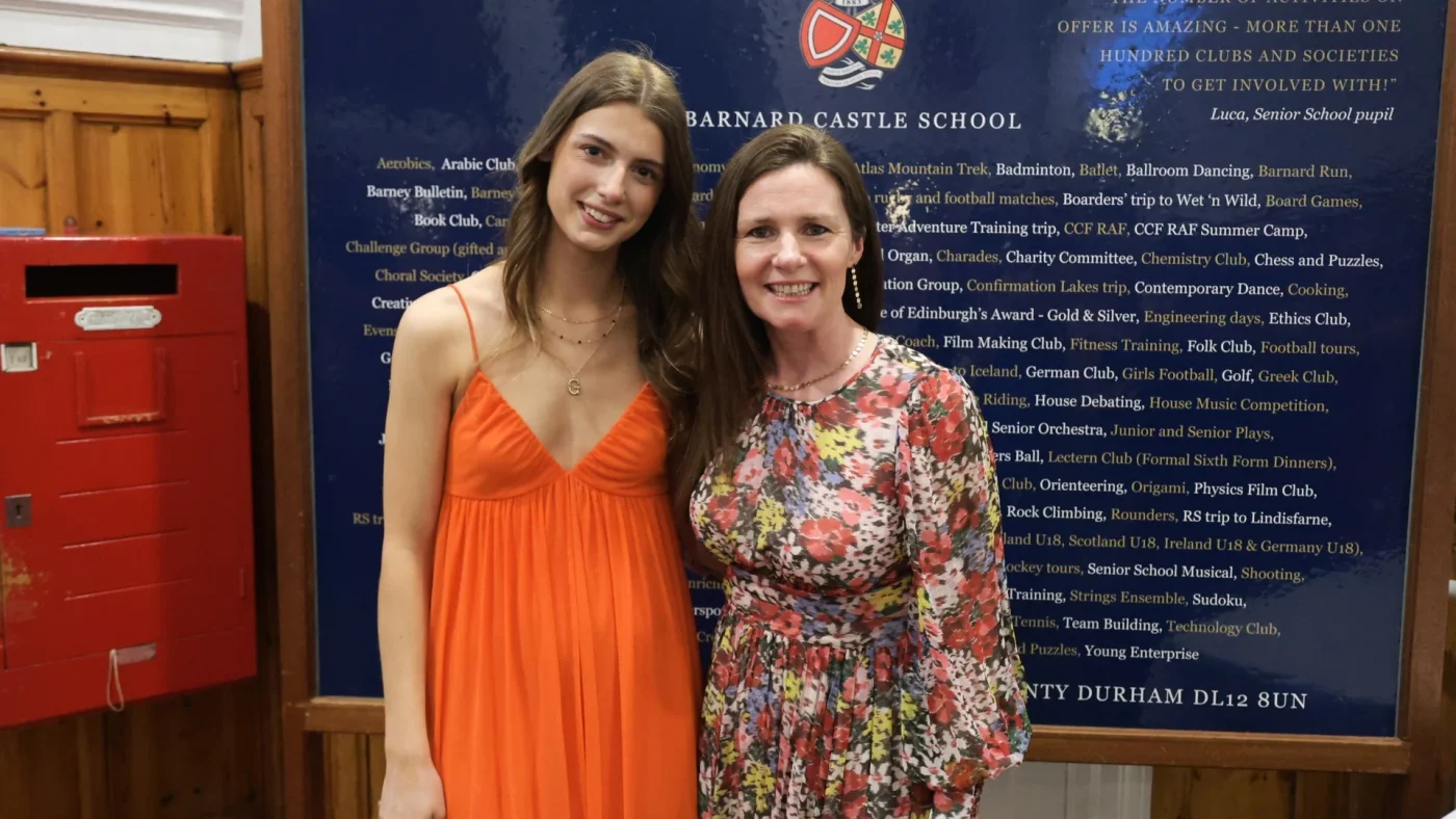 A Barney student and member of staff in formal attire at the Longfield Dinner.