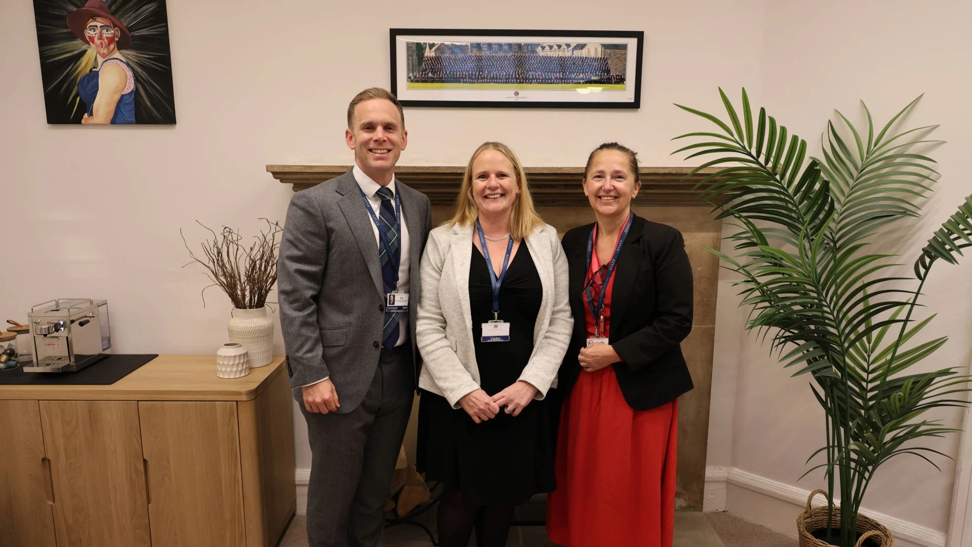 Barney Headmaster David Cresswell standing with agents.