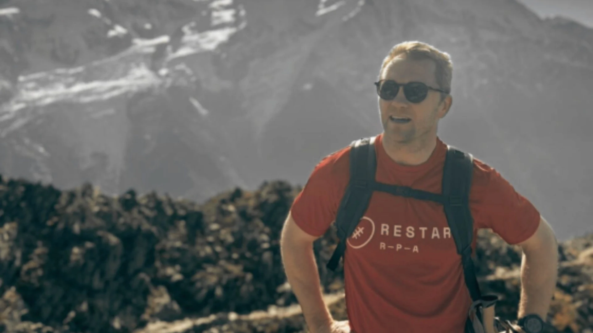 Alex Tait stands atop the French Alps.