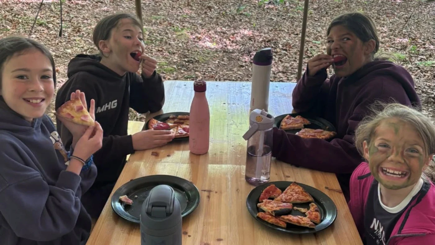 Barney Year 5 girls enjoying lunch in the woods.