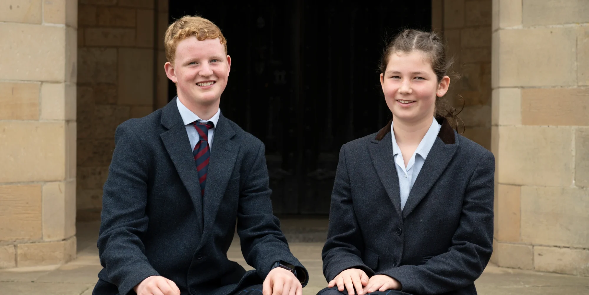 Two BCS students showcasing the Barnard Castle Uniform