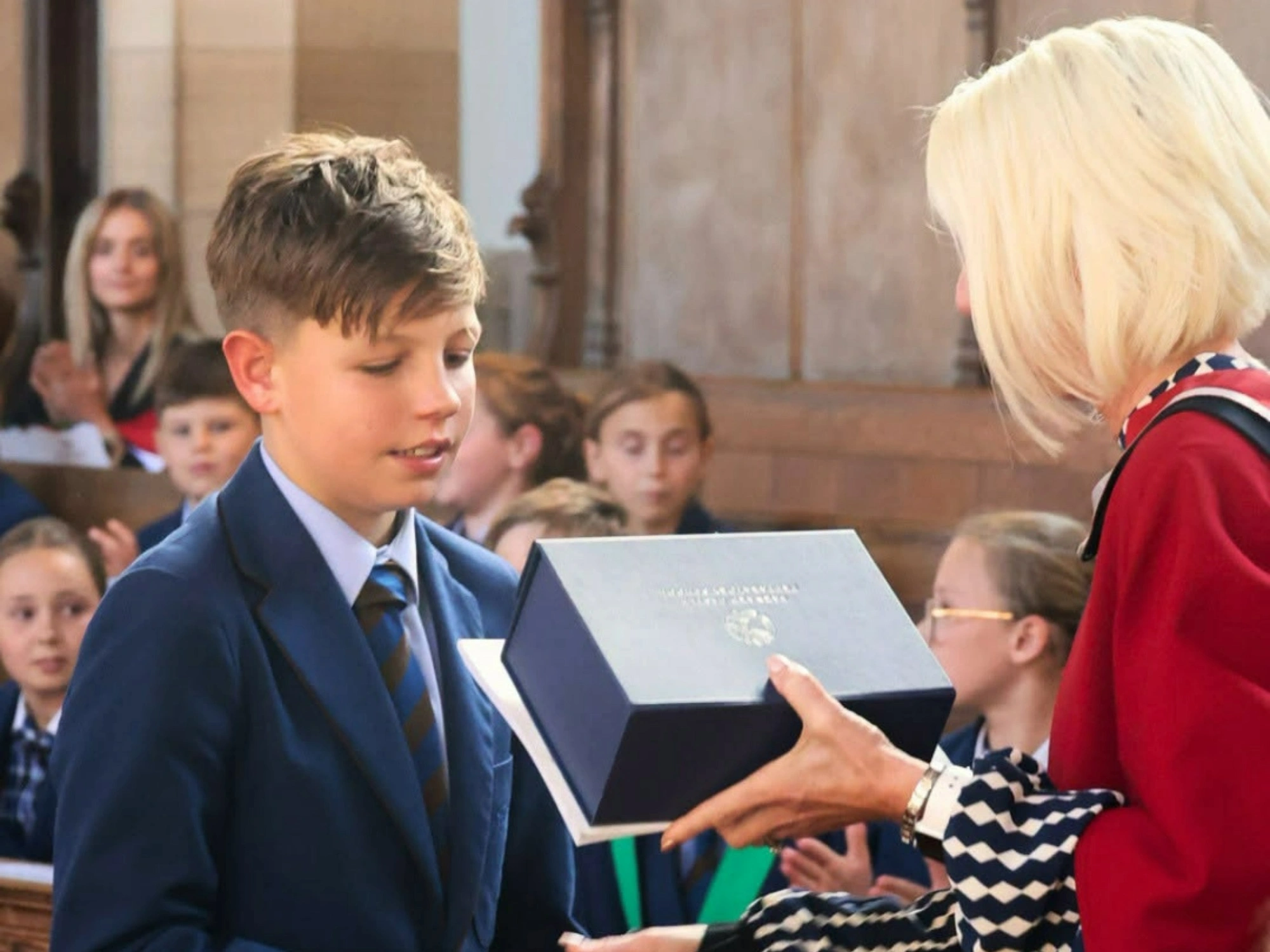 Barnard Castle School Year 6 student receives blue box at Valedictory Service.
