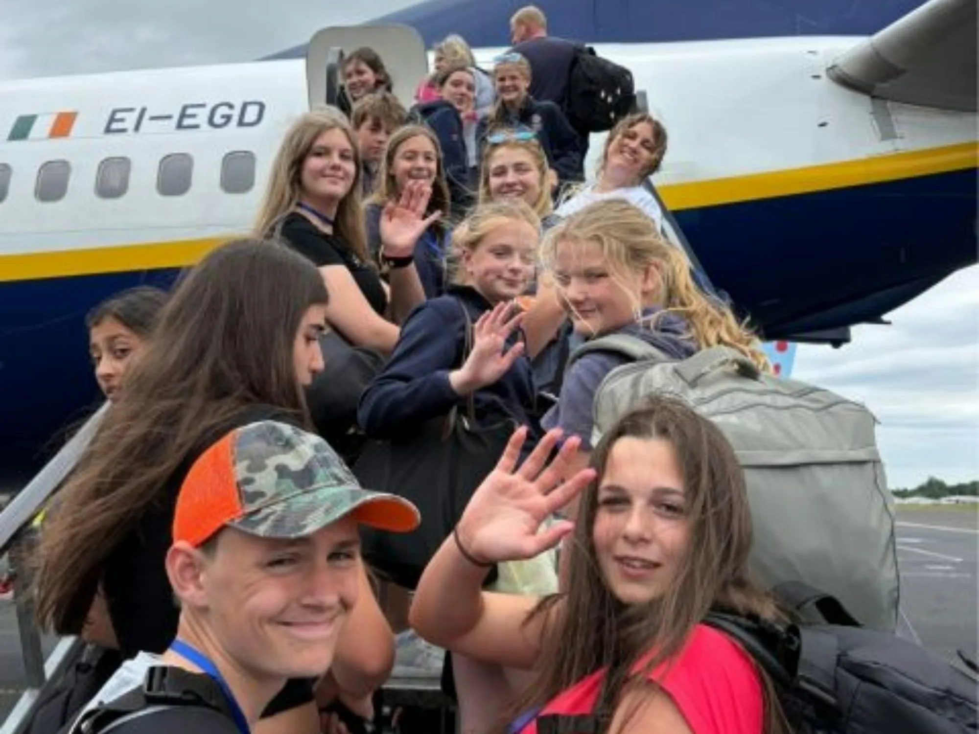 Barney students boarding plane durign their Malaga trip.