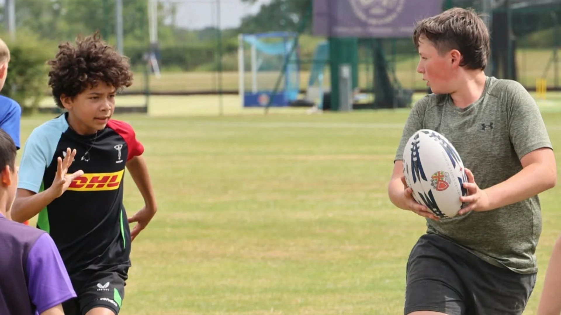 Students doing passing drills during Barney Rugby Academy.