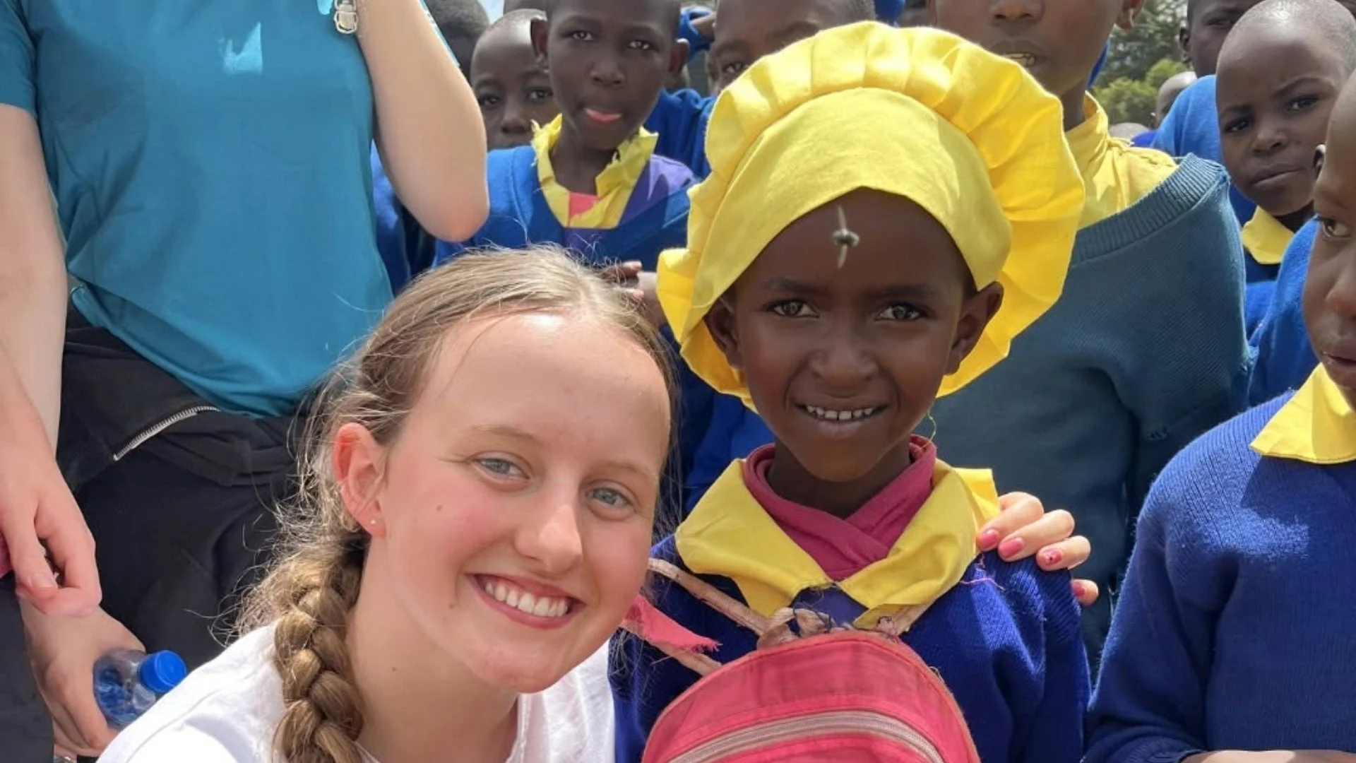 A young local girl and Barney student smiling on the Kenya expedition.