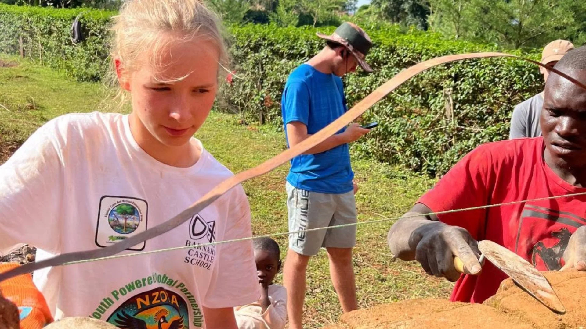 A Barney student helps with construction in Kenya.