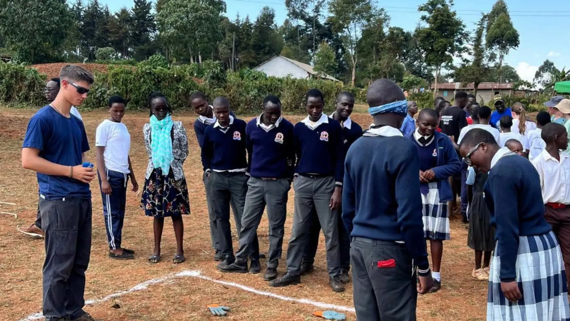 Barney students play with locals on the Kenya expedition.